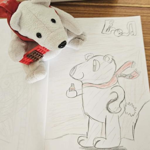 Drawing of a bear with the soft toy next to it