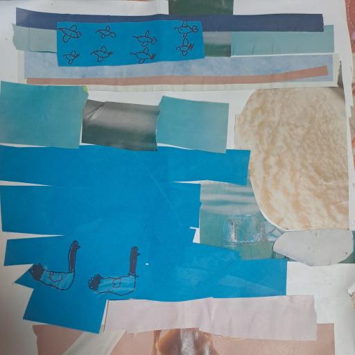 Pieces of blue and white paper and ducks in a collage